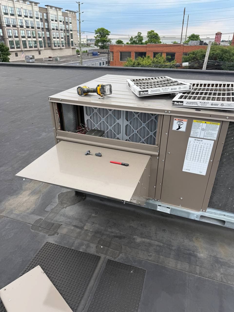 Commercial rooftop HVAC unit inspected during maintenance in New Jersey