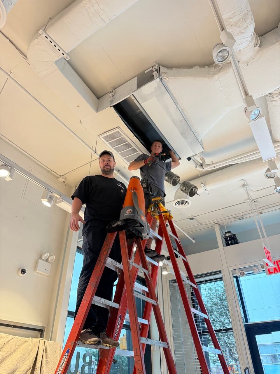 Sadowski HVAC technicians performing planned commercial coil maintenance